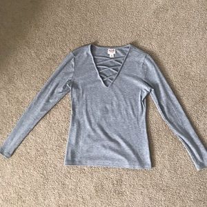 Gray long-sleeve top with a v-neck cut out design